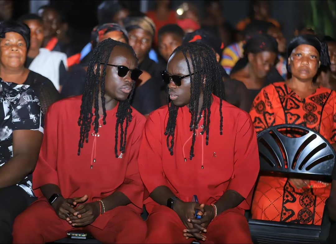Mystic Twins with family at a portrait unveiling