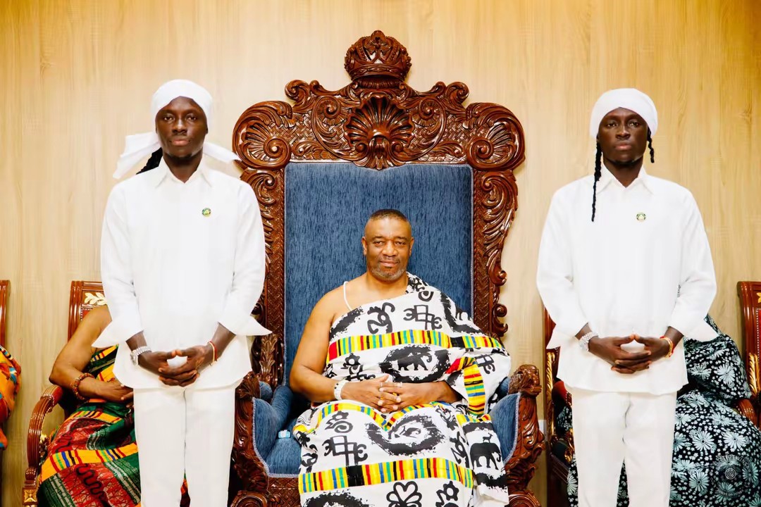 The Mystic Twins with a chief on his throne